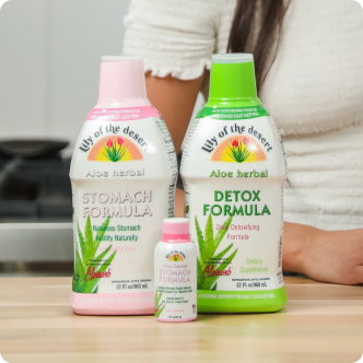aloe herbal stomach formula and detox formula on kitchen counter - Lily of the Desert